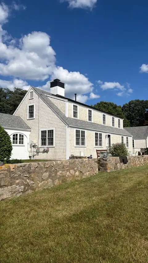 Exterior of a Cape style home after work by Hyannis Painting